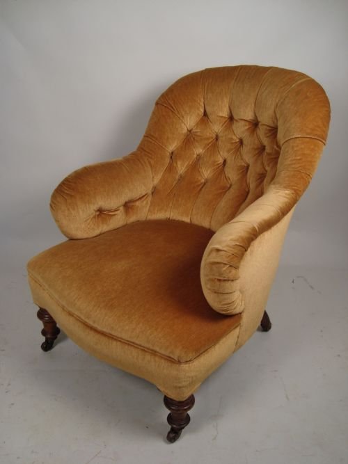 a victorian button backed armchair